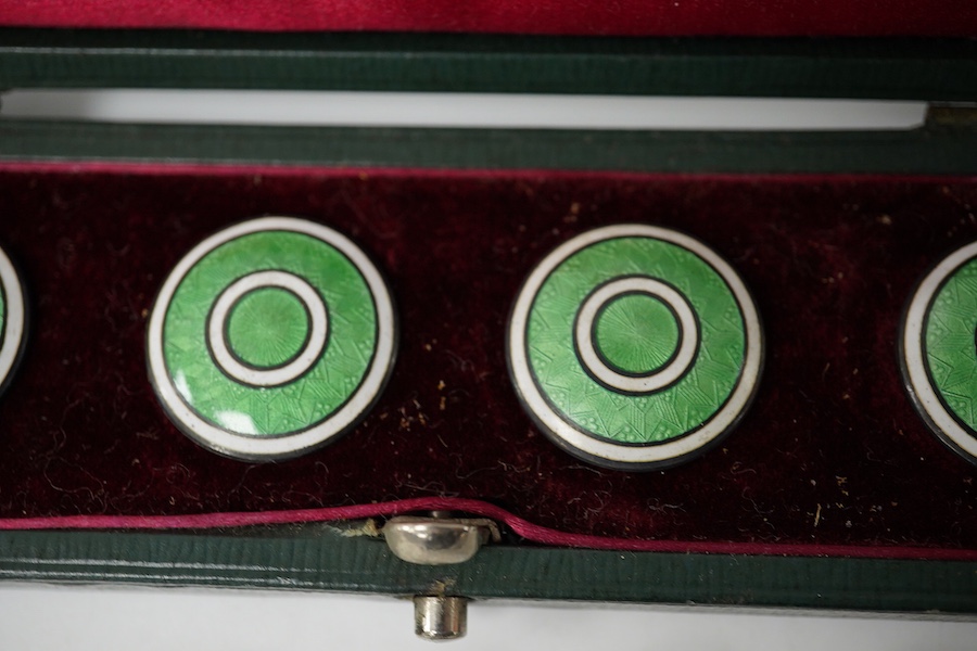 An Edwardian set of 6 blue and white enamelled buttons, marked Sterling, 10mm and a cased set of 5 (ex 6) green and white enamelled buttons, unmarked, 20mm. Condition - good